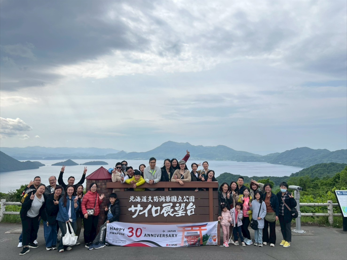 Hwafune employee group photo during company trip in Japan